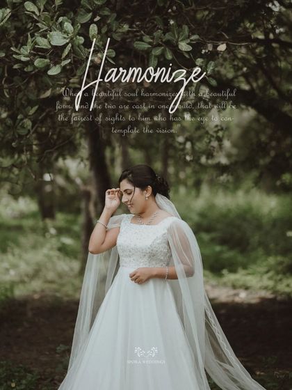 A portrait of the bride in the woods, the word "Harmonize" reflecting the peace and beauty of the moment.