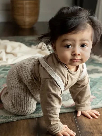 On the move. This shot captures the determination and curiosity of a baby learning to crawl, a milestone full of character.
