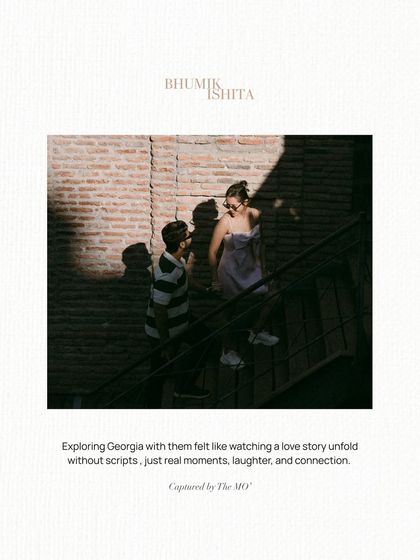 A candid moment captured on a staircase, with strong shadows creating a dramatic effect. The text overlay emphasizes the unscripted nature of their story unfolding in Georgia.
