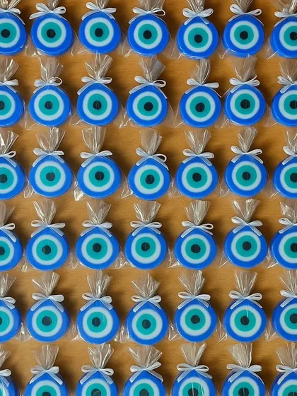 A grid of my evil eye soaps, individually wrapped and ready to be gifted as tokens of protection.