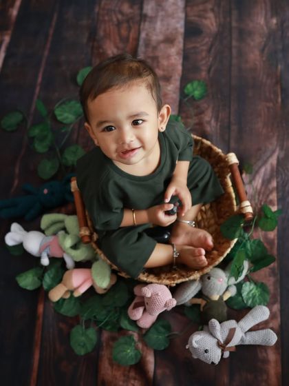 An overhead view of this little guy in his basket. I love this perspective for showing off his cute expression and all his little friends.