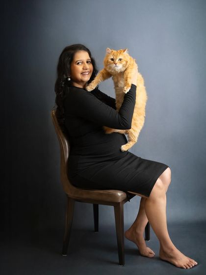 Fur babies are family too. I absolutely love it when clients bring their pets along, like in this adorable portrait of a mom-to-be celebrating with her beloved cat.