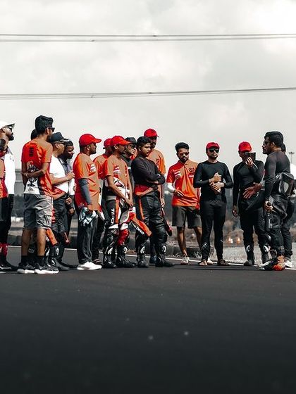 A group of coaches and riders during a track walk.