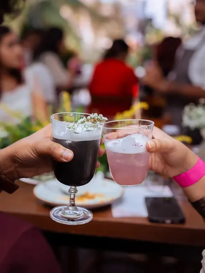 A toast between friends with our colorful cocktails during the Puffizza 2.0 event.
