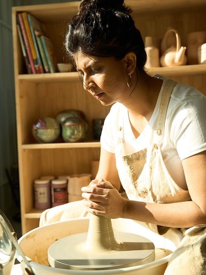 Another photo of me at the wheel. I believe in being open with my work and my journey, and I'm even learning Japanese this year to keep growing.