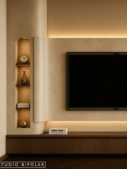 The TV wall is kept minimal and clean, with a floating console and recessed niches for display. Backlighting adds a soft, ambient glow, making the space feel cozy and inviting.