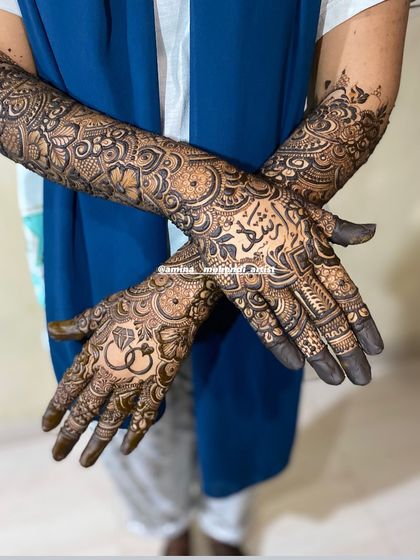 A beautiful design featuring a ring motif and the name 'Rizwan' in Arabic script.