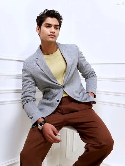 Another look from the same model portfolio shoot. The seated pose is more relaxed, showing a different, more contemplative side to the camera.