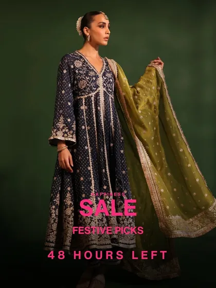 A dramatic shot of the Rangeela Navy Anarkali. The way the olive green dupatta drapes is just beautiful. Don't miss this festive pick in the sale.
