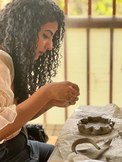 A participant from the Sugarfit team enjoying a moment of creative flow during our hand-building workshop.
