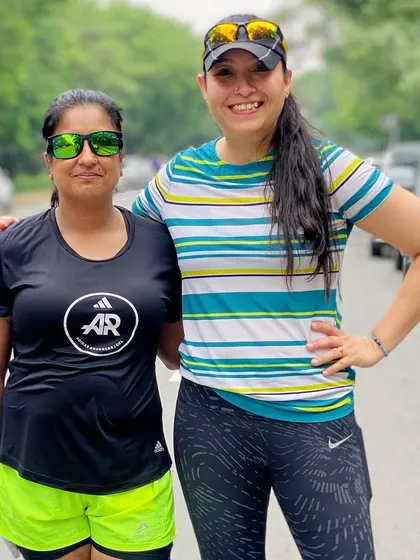 Two of our female runners sharing a moment of camaraderie. The women in our group are a huge source of inspiration and support for everyone.