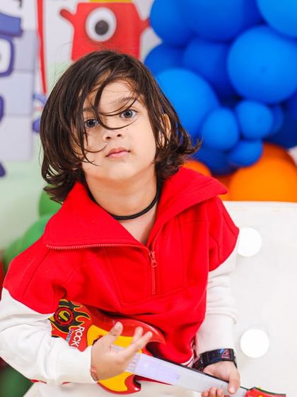 A charming 'Woodland' themed birthday party, with rustic decor, forest animal cutouts, and natural elements, creating a cozy and enchanting setting.