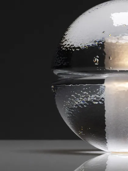 A close-up, macro shot of the clear glass Bocci 14p, highlighting the textured surface and the small air bubbles that make each piece unique.