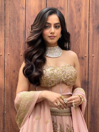 A beautiful portrait showcasing big, bouncy waves. This open hairstyle is perfect for a bride who wants a glamorous yet effortless look for one of her pre wedding functions.