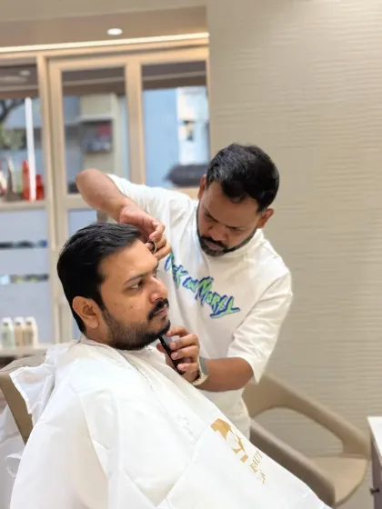 Using scissors for the finishing touches, our stylist ensures that every hair is in place for a perfectly groomed beard.