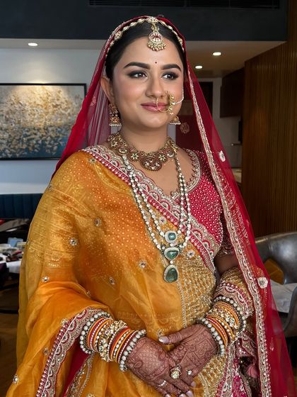 The addition of the yellow dupatta brings a beautiful pop of color. Her makeup is versatile enough to work with the full, traditional ensemble.