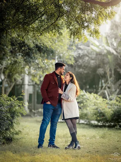 A quiet moment shared between a couple during their outdoor pre-wedding session. We used the soft, golden hour light filtering through the trees to create this warm, vintage feel, guiding them into a pose that feels both romantic and natural.