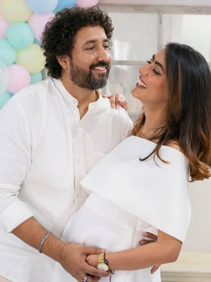 The love between partners shines during a baby shower. I focus on capturing these candid interactions and celebrations with friends and family.