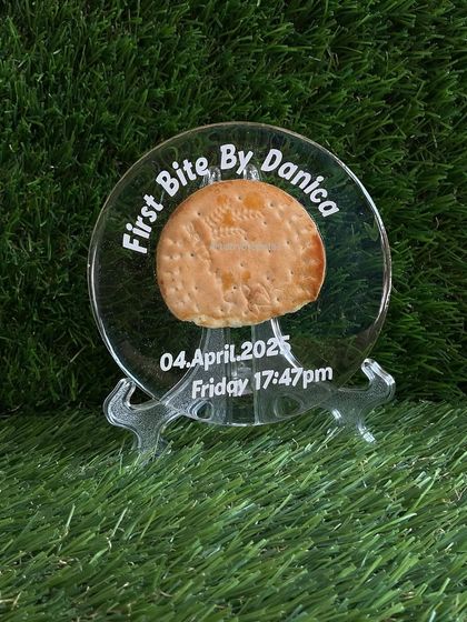 The preserved biscuit plaque, displayed on a stand. It’s a small piece, but it holds such a big memory for the family.