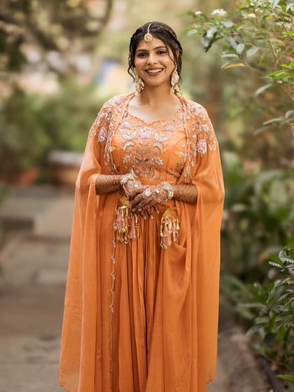 The bride looking happy and beautiful, ready to be showered with love and turmeric.