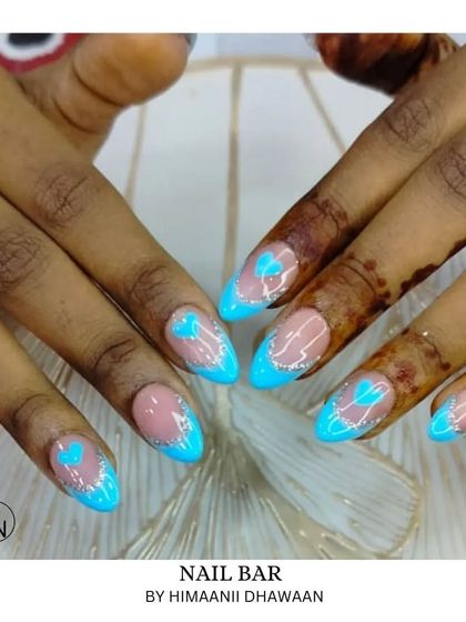 A bright and fun design with neon blue tips and a cute heart detail, perfect for summer.