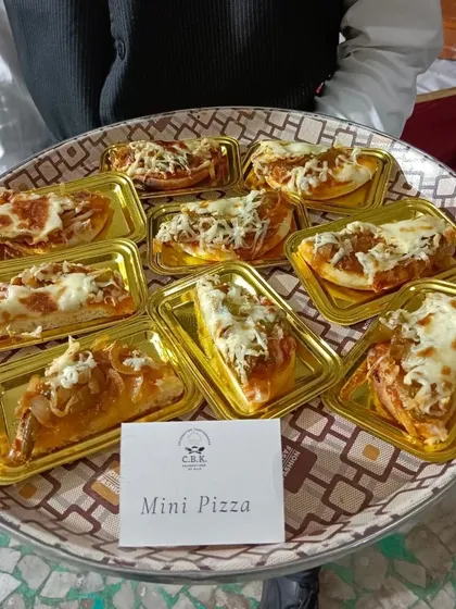 Our Mini Pizzas are always a hit, especially at kids' birthdays and casual get togethers. Topped with cheese and savory sauce, they are a simple and delicious party food solution.