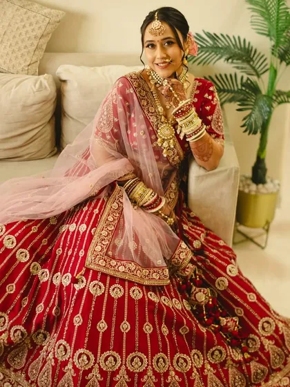 A happy, smiling portrait of the bride. The makeup is fresh and radiant, designed to enhance her natural beauty and capture her joyful spirit.