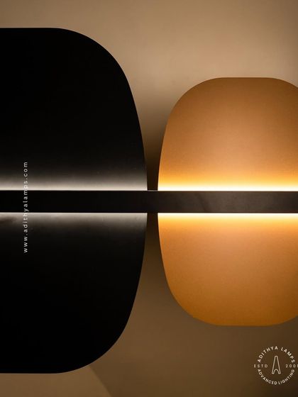 A study in balance and contrast, this fixture features opposing black and gold panels bisected by a line of light. This piece embodies the principle of yin and yang, offering a minimalist yet deeply symbolic lighting solution.