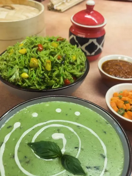 For those who love Thai flavours, I offer a delicious Thai Green Curry served with Green Schezwan Rice. It's a fragrant and creamy dish that's both comforting and exotic.