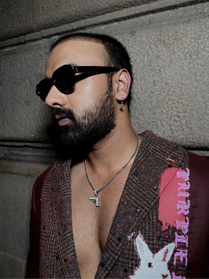 A detail shot of Arshad Ahmed in the Phantasm Suit, highlighting the textured fabric and unique patchwork.