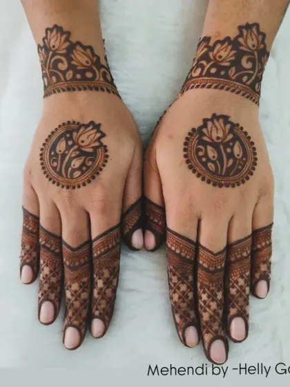 A beautiful back-hand design with a central lotus mandala. The fingers are intricately detailed, while the palm is left open.