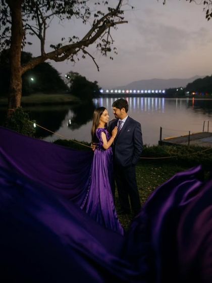 A beautiful twilight shot by the lake. The rich purple color of the gown looks incredibly romantic and sophisticated in the evening light.