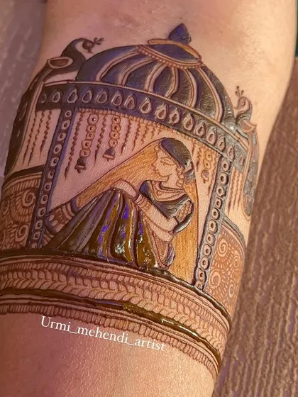 Another angle of the bride in a doli, showing the intricate details on the palanquin and the delicate posture of the bride figure.