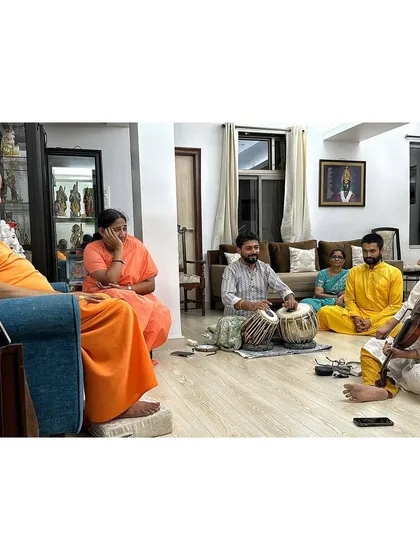 A picture capturing a moment of blessing after our performance for Guruji Swami Tejomayananda ji, alongside Vidushi Kala Ramnath ji and my Aai.