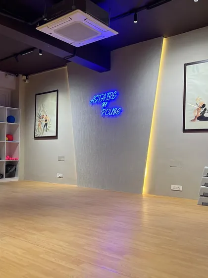 Our dedicated Group X Studio, ready for action. With its spacious wooden floor, full-length mirrors, and energizing neon sign, this is the perfect space for yoga, dance, and aerobics classes.