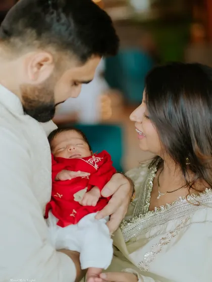 A moment of quiet admiration between new parents and their baby. The love in this room was so beautiful to witness.