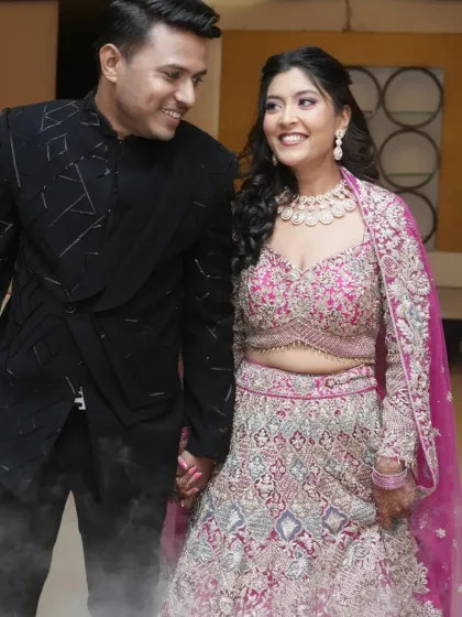 Walking hand-in-hand, this couple is all smiles. Her engagement makeup is fresh and youthful, perfect for celebrating this happy milestone.