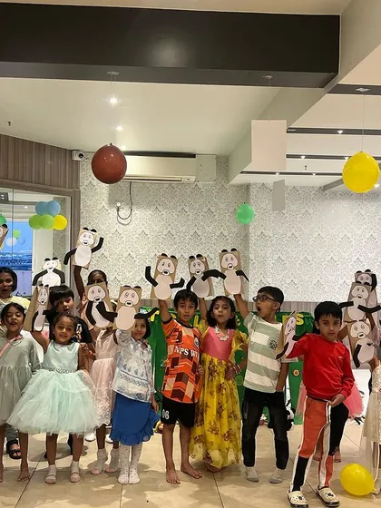 The whole group proudly displaying their 'Po' the Panda puppets after our Kung Fu Panda show. It's a great photo opportunity and a fun memory for the kids.