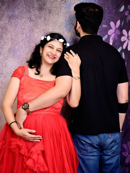 A romantic and gentle pose during a maternity shoot. This style of portrait focuses on the connection and quiet intimacy between the couple.