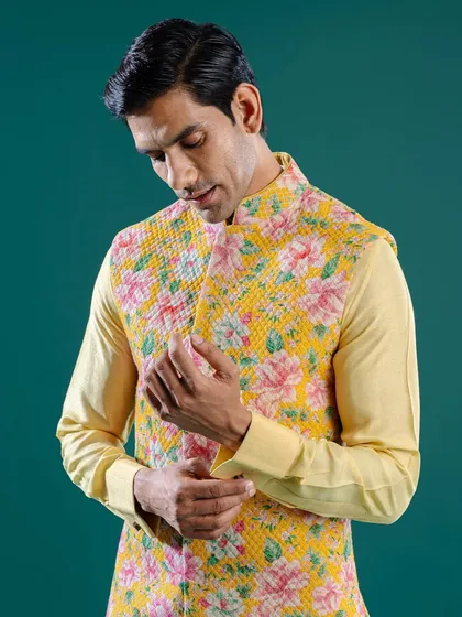 This bright yellow Jawahar jacket is brought to life with a cheerful print of pink and green florals. It is a perfect ensemble for a spring wedding, exuding joy and sartorial confidence.