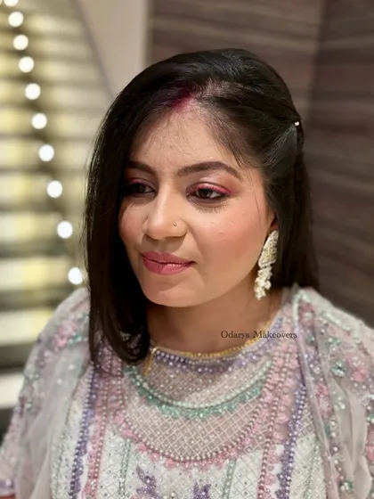 A soft and artistic look for a Sangeet guest. The makeup is minimal but effective, creating a beautiful, ethereal glow.