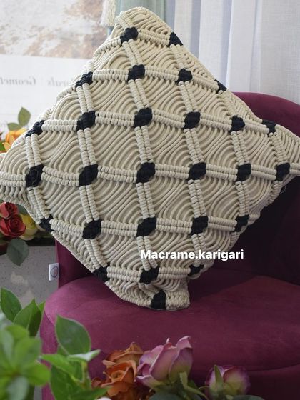 A detailed shot of the knotwork on our macramé cushion cover. This piece is a testament to the skill and patience that goes into our handmade decor.