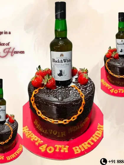 A rich chocolate cake for a 40th birthday, topped with a bottle of Black & White whisky, fresh strawberries, and a gold chain.