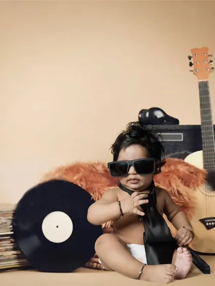 Let's get creative with fun themes like this 'Little Rockstar' setup. My costume and prop box has something for every personality, ensuring we create photos that are unique to your child.