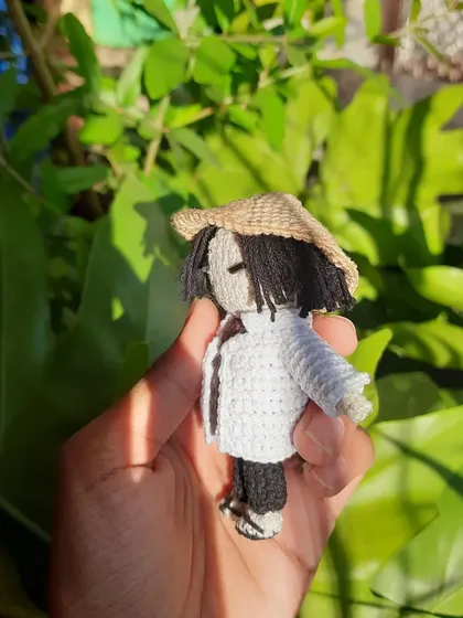 A side view of the Yoongi amigurumi, showing the details of his hair and the fit of his little hat. I love the challenge of turning a 2D idea into a 3D creation.
