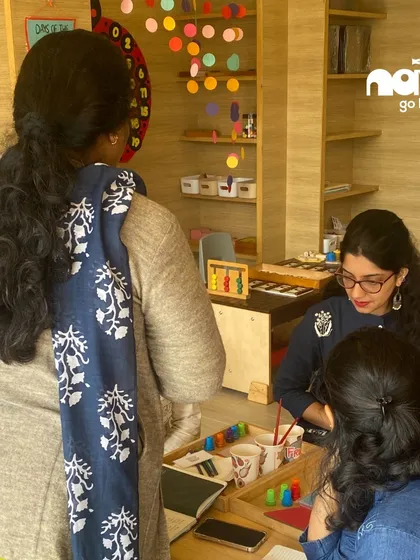 Educators exploring creative materials during our Reggio Emilia workshop, learning how to foster an environment where students can express themselves.