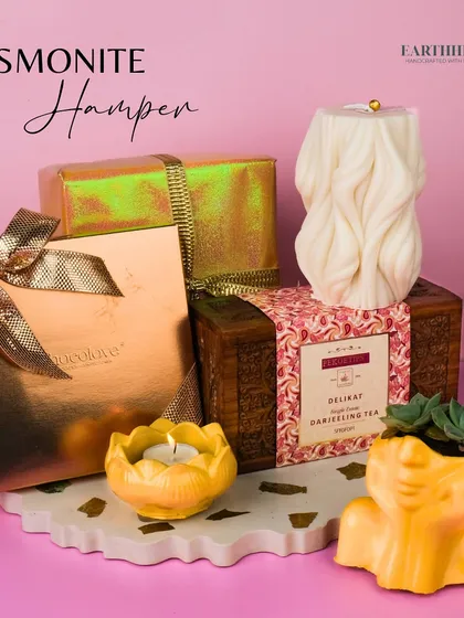 My Jesmonite Hamper is a unique gift, featuring a handmade tray, planter, and tea-light holder, paired with chocolates and tea.