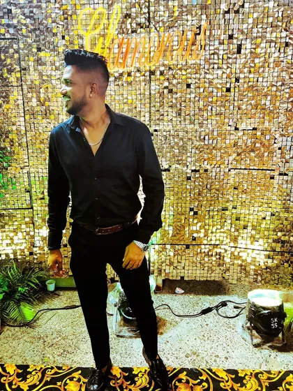 All black for a glamorous wedding reception. This look is perfect for a classy evening event or a high-energy Sangeet night.