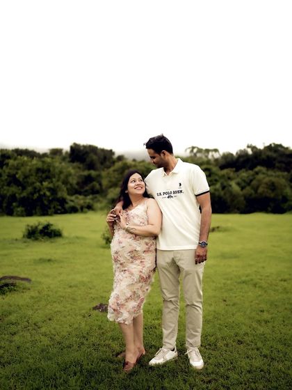 A classic, happy portrait of the couple standing together in a field. It’s a simple, beautiful shot that showcases their love.