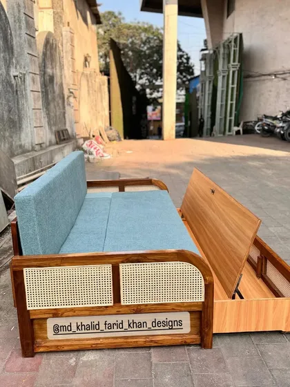 The pull-out section is partially extended, showing how easily it converts into a bed.